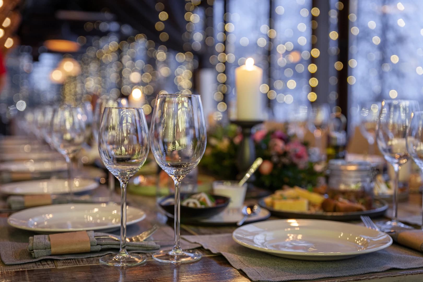 A dining table set with elegant dinnerware and cutlery.
